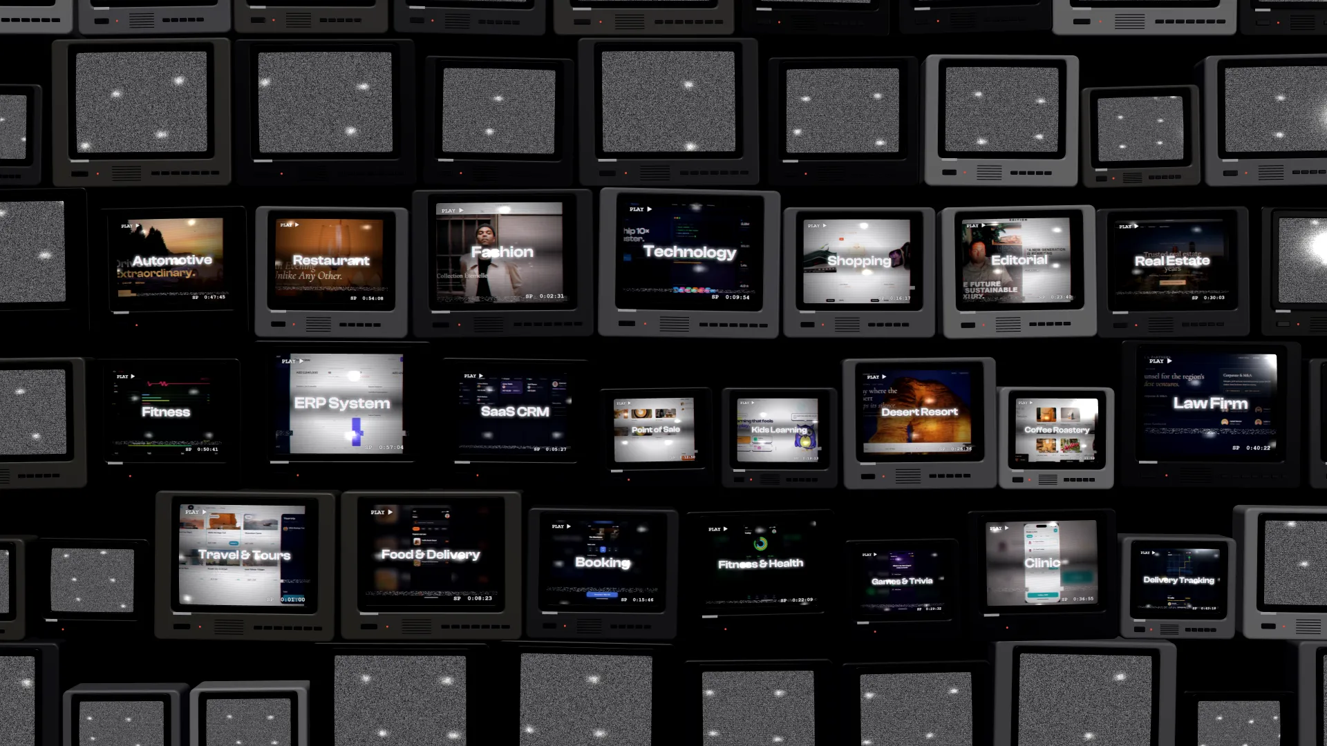 A wall of old televisions playing Studio demos